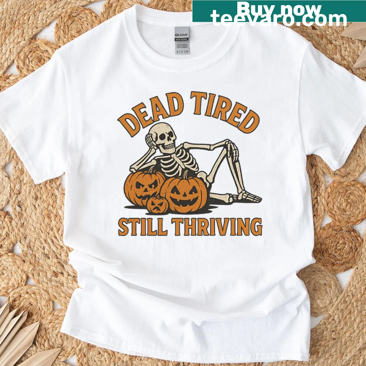 Cartoon skeleton with pumpkin Halloween-themed t-shirt — on a men's t-shirt