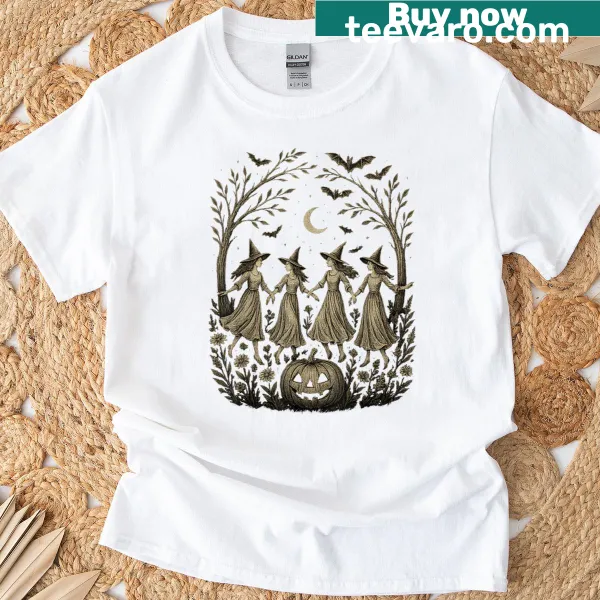 Whimsical witch graphic on a floral Halloween themed T-shirt.