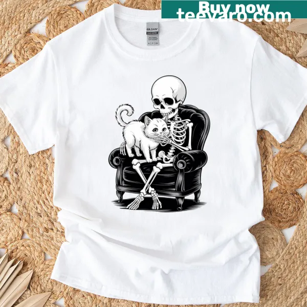 Cartoon skeleton with a cat graphic on a Halloween T-shirt