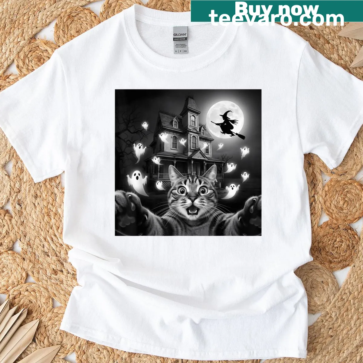 Illustration of a cat taking a selfie in a spooky Halloween setting with witches and ghosts. — on a men's t-shirt