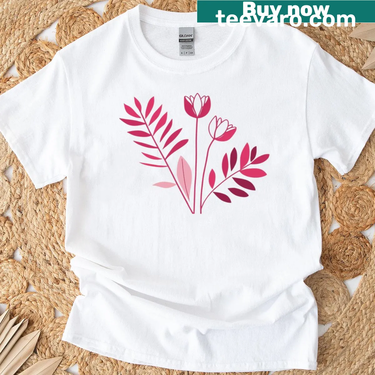 Minimalist t-shirt featuring a pink floral illustration — on a men's t-shirt