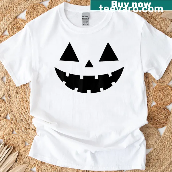 Cartoon pumpkin face design on a Halloween-themed shirt