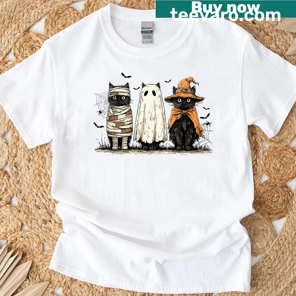 Retro Halloween t-shirt with black cat, ghost, and witch design — on a men's t-shirt