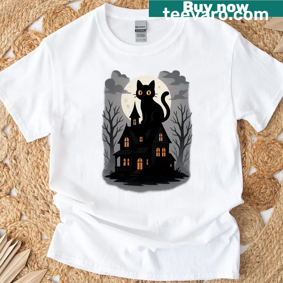 Halloween-themed T-shirt featuring spooky cats and a haunted mansion illustration. — on a men's t-shirt