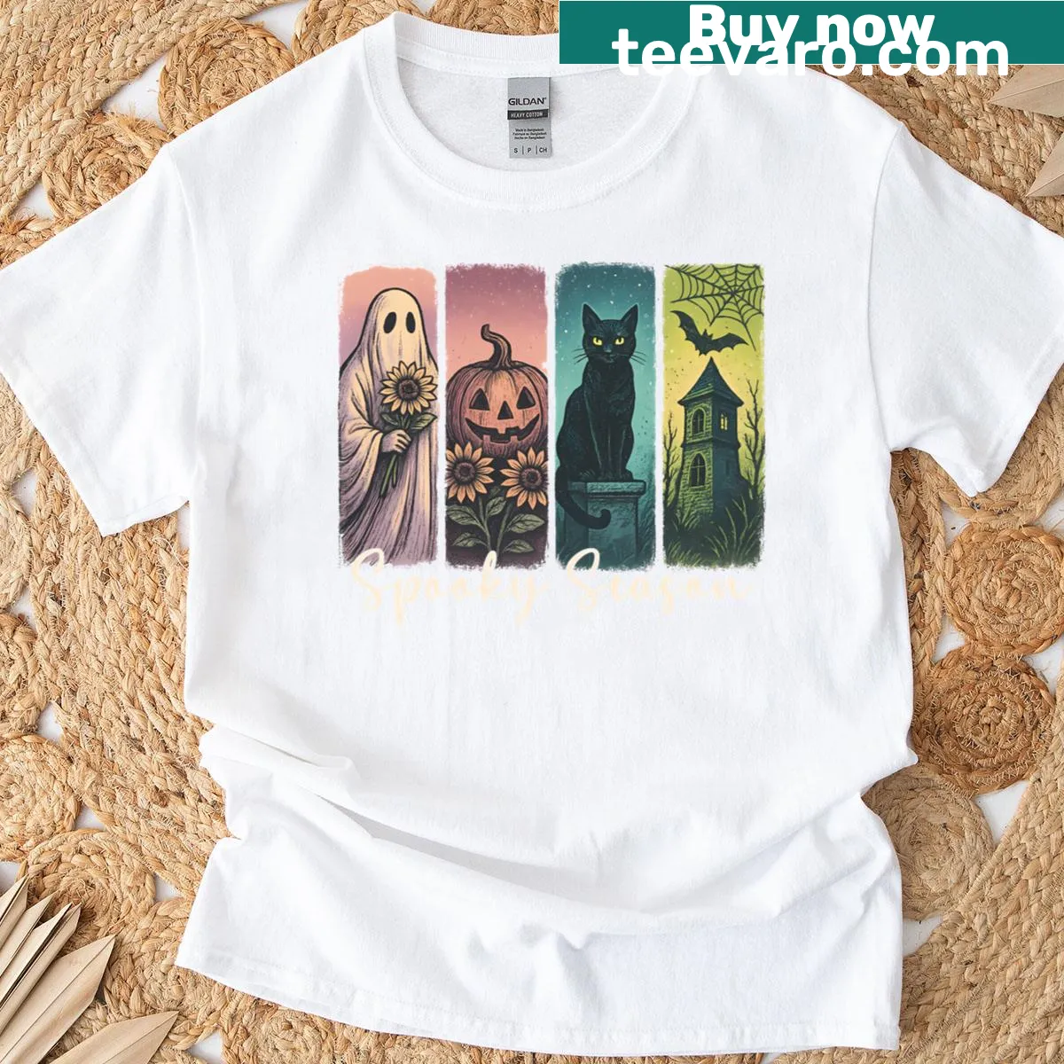 Cute Halloween T-shirt with a ghost, black cat, and haunted house design — on a men's t-shirt