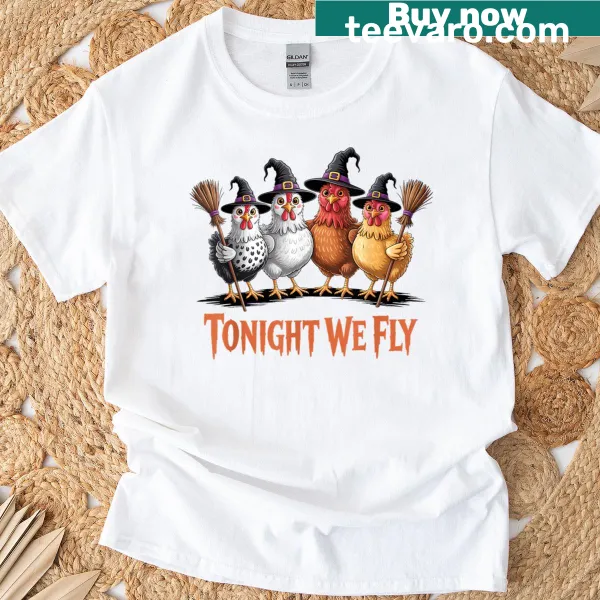 Cartoon witch chicken design on a Halloween-themed t-shirt.