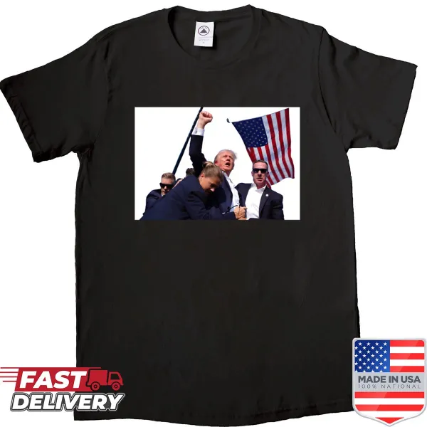 Humorous Trump shooting shirt with playful graphics.