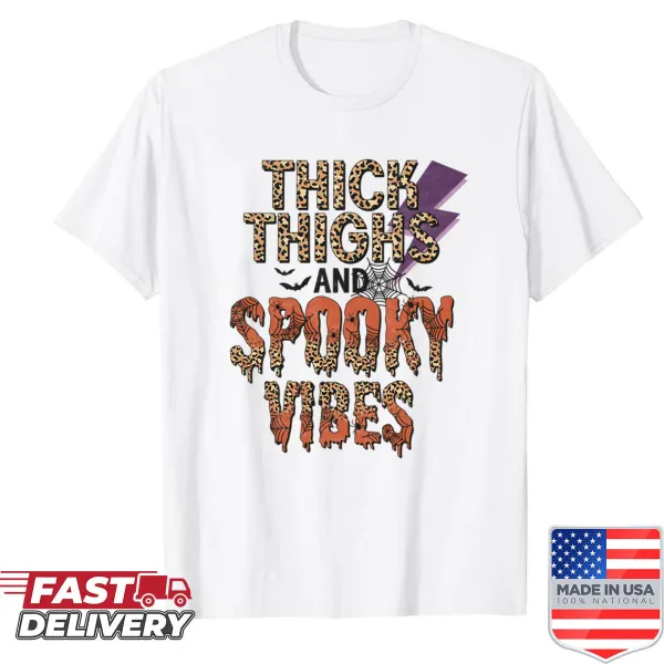 Oversized Halloween shirt featuring the phrase 'Thick Thighs And Spooky Vibes.'