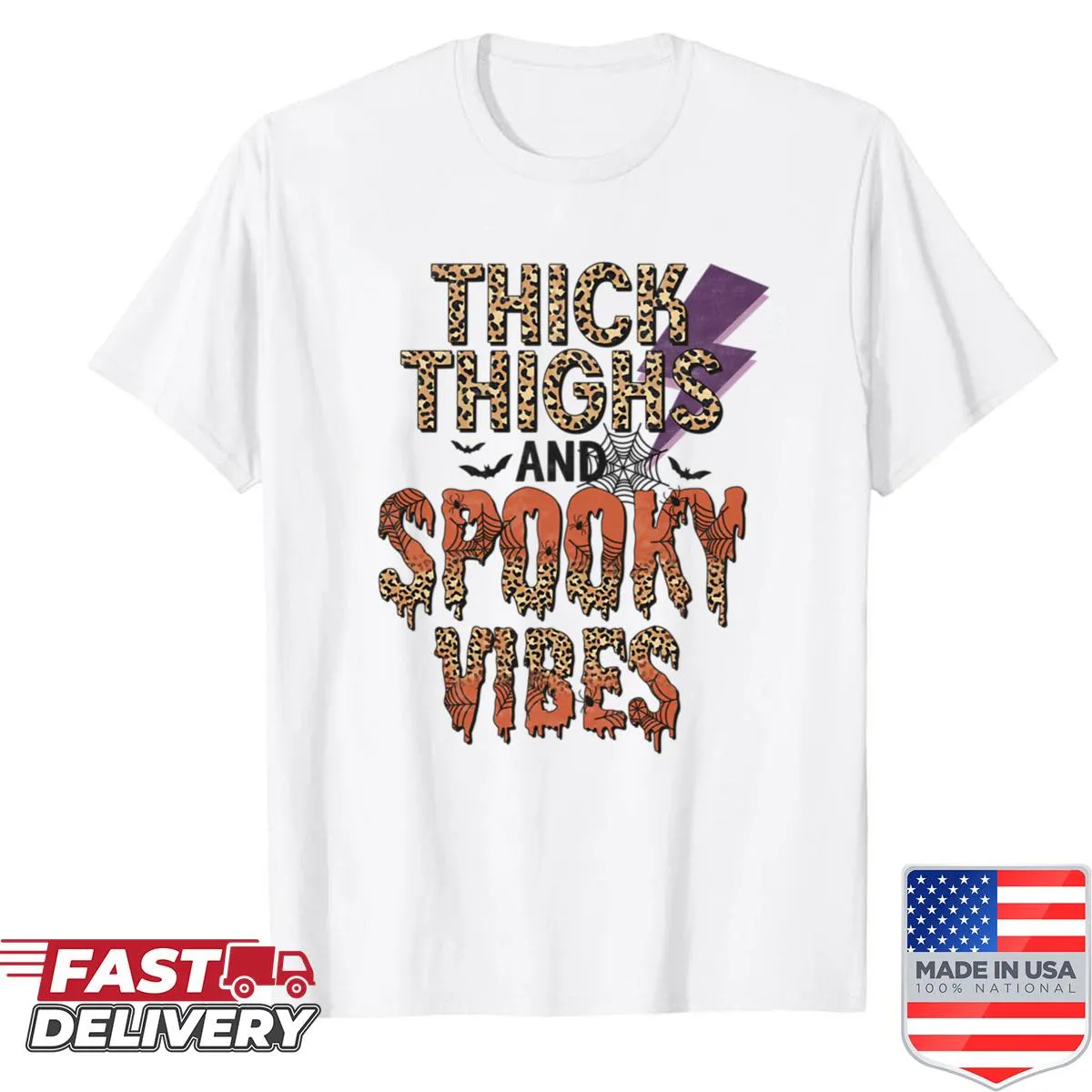 Oversized Halloween shirt featuring the phrase 'Thick Thighs And Spooky Vibes.'