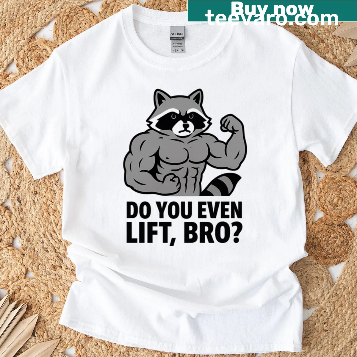 Funny flexing raccoon graphic with gym phrase on t-shirt — on a men's t-shirt