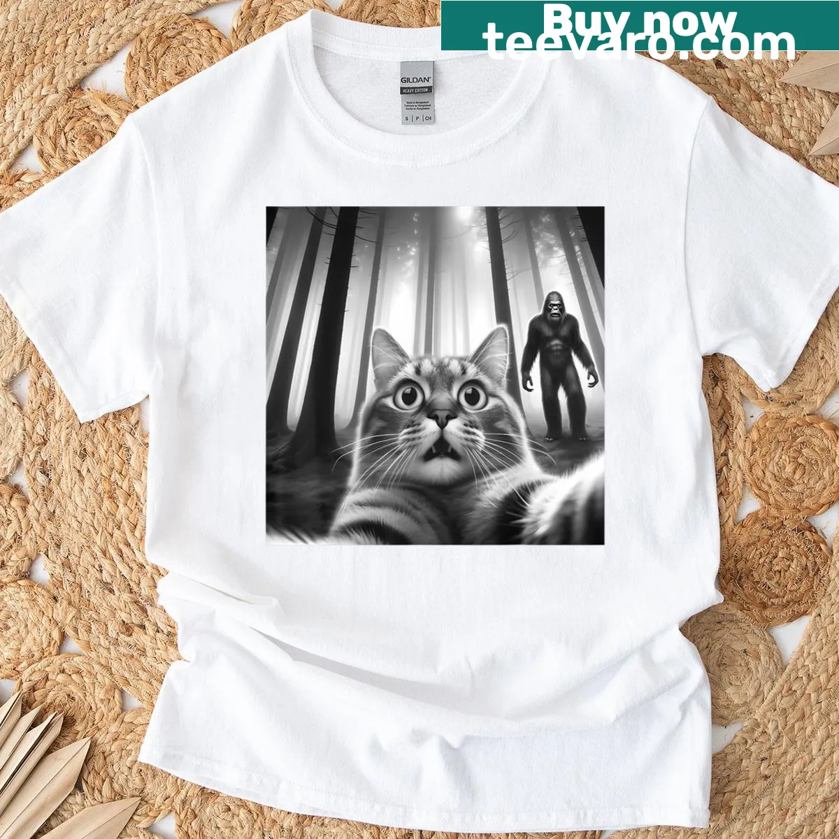 Funny t-shirt featuring a scared cat taking a selfie with Bigfoot — on a men's t-shirt