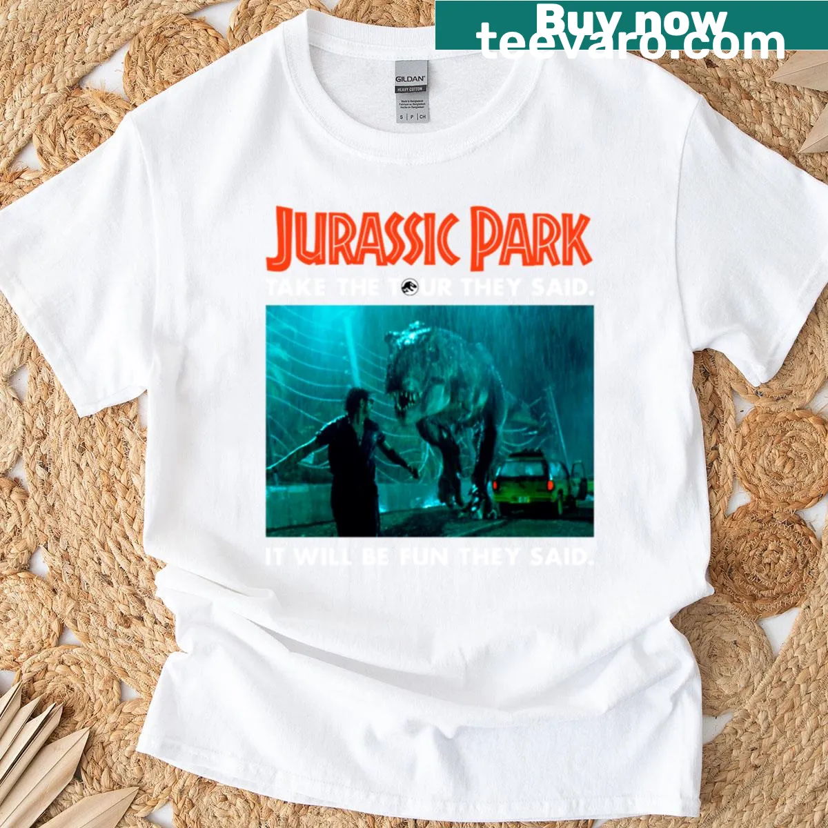 T-shirt featuring Dr. Ian Malcolm from Jurassic Park with T-rex illustration — on a men's t-shirt