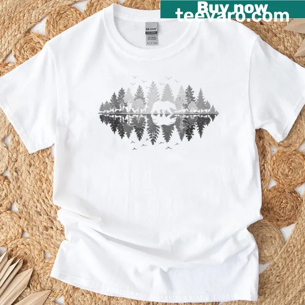Illustration of a bear and trees reflecting in water on a nature-themed T-shirt