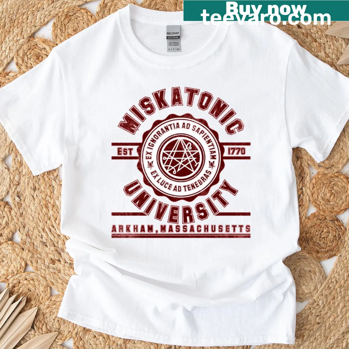 Illustrated Miskatonic University crest t-shirt — on a men's t-shirt