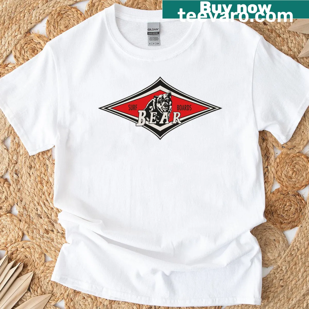 Cartoon surfing bear graphic T-shirt with retro surf logo — on a men's t-shirt