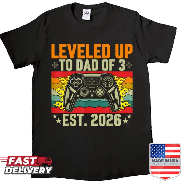 Shirt with the phrase 'Leveled Up To Dad Of 3' celebrating fatherhood.