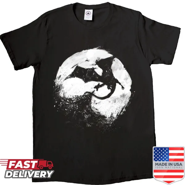 Eerie landscape illustration on a shirt featuring dark trees and a twilight sky.