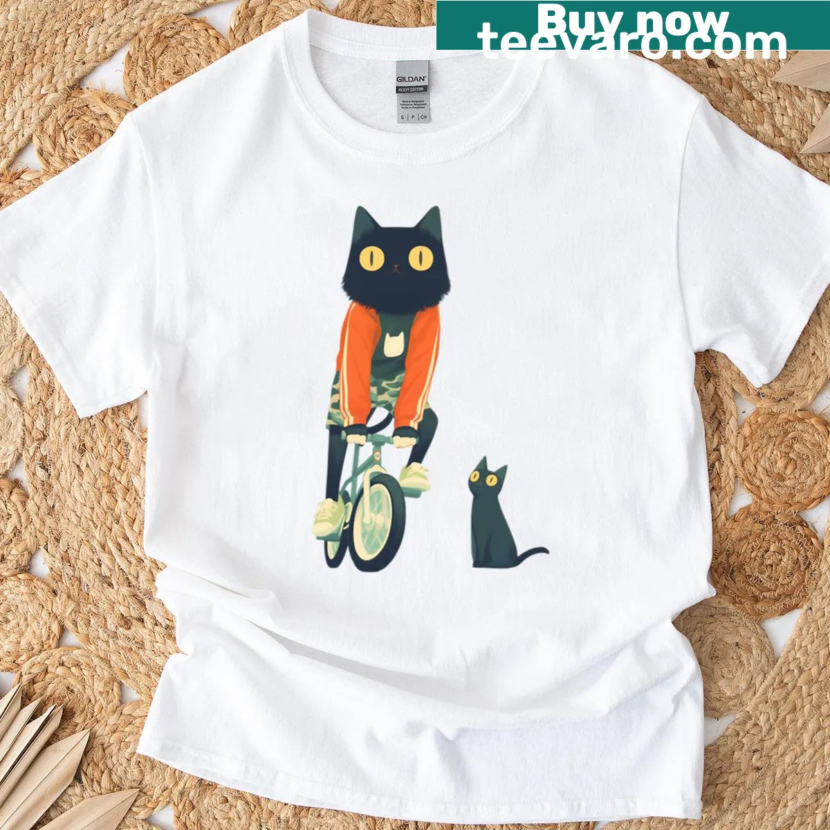 Kawaii illustration of a black cat riding a bike on an oversized T-shirt. — on a men's t-shirt