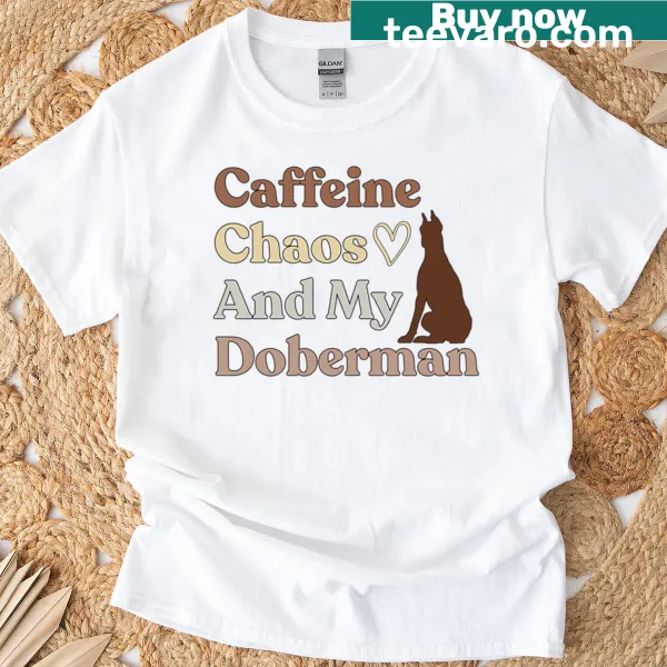 Funny dog mom t-shirt with a quote about caffeine and Doberman chaos.