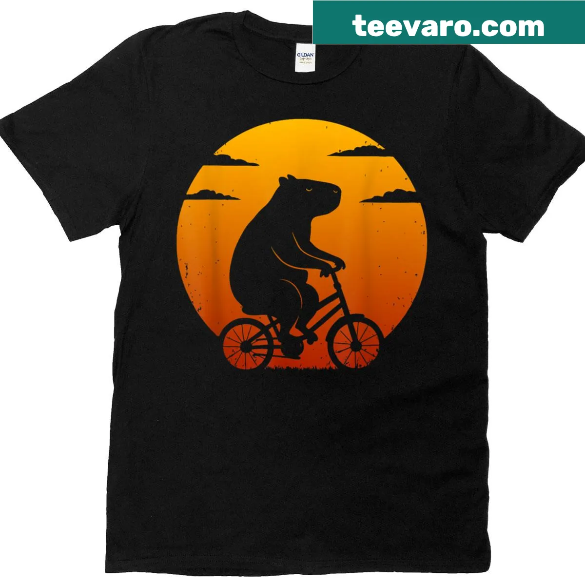 Silhouette T-shirt of a capybara riding a mountain bike at sunset — on a men's t-shirt