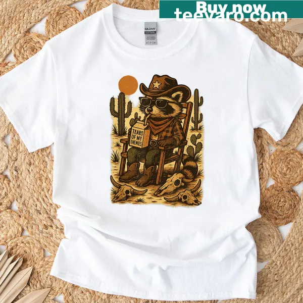 Funny T-shirt with a cartoon cowboy raccoon design