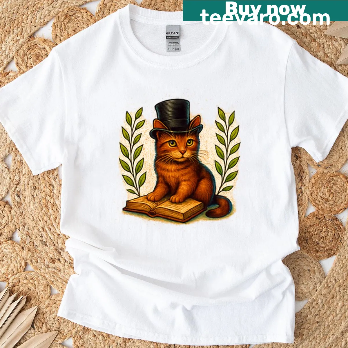 Oversized t-shirt featuring a dapper cat in a top hat with book illustrations — on a men's t-shirt