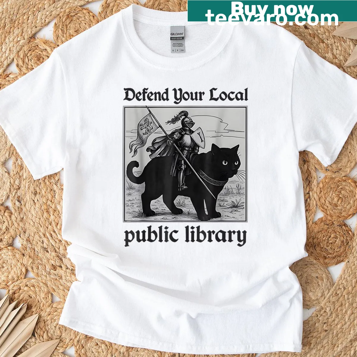 Funny t-shirt with a cat in armor saying 'Defend Your Local Public Library' — on a men's t-shirt