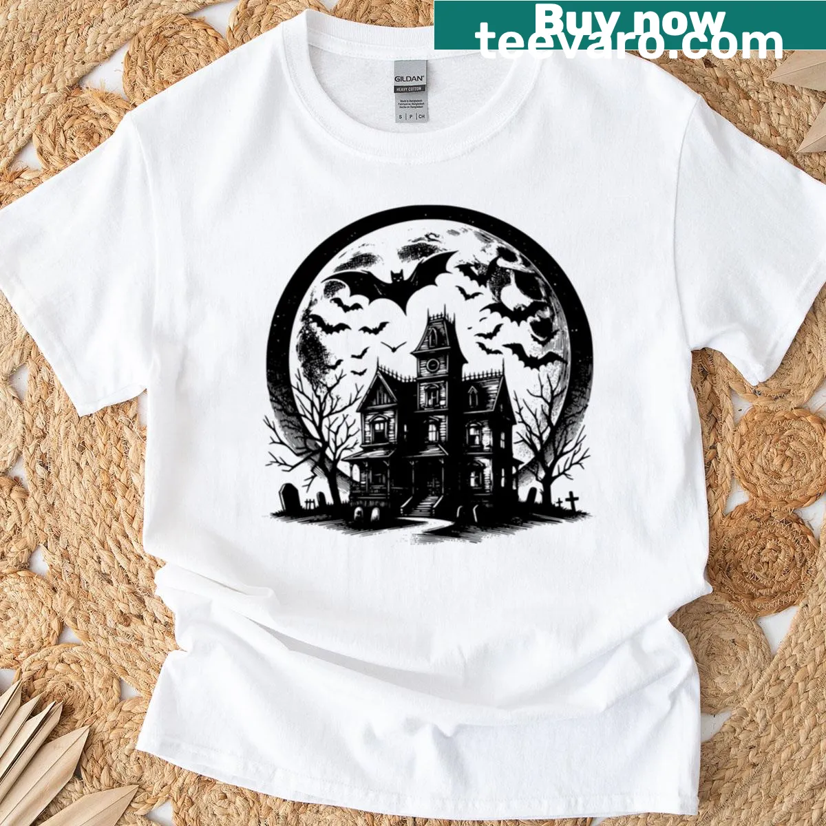 Halloween T-shirt with whimsical haunted house design — on a men's t-shirt