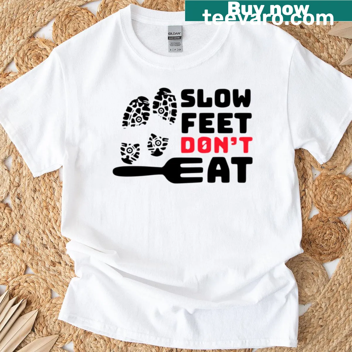 Playful typography shirt that reads 'Slow Feet Don't Eat'. — on a men's t-shirt