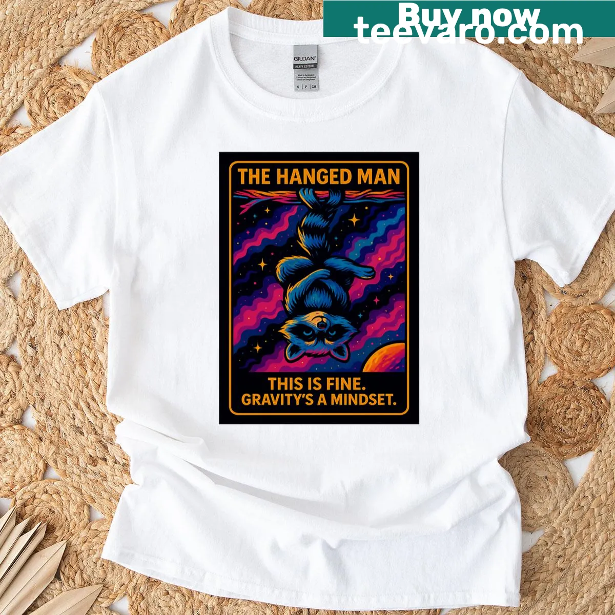 Funny oversized t-shirt featuring Hanged Man tarot raccoon design — on a men's t-shirt