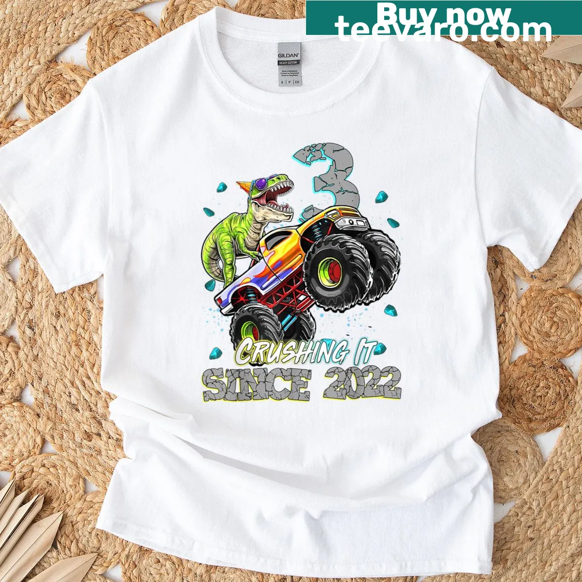 Illustrated design featuring a dinosaur and monster truck for a birthday boy on a t-shirt. — on a men's t-shirt