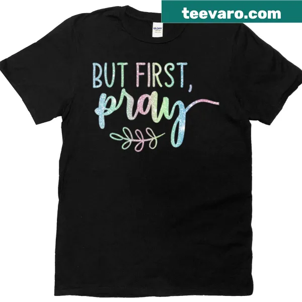 Hand-lettered design saying But First Pray on a T-shirt