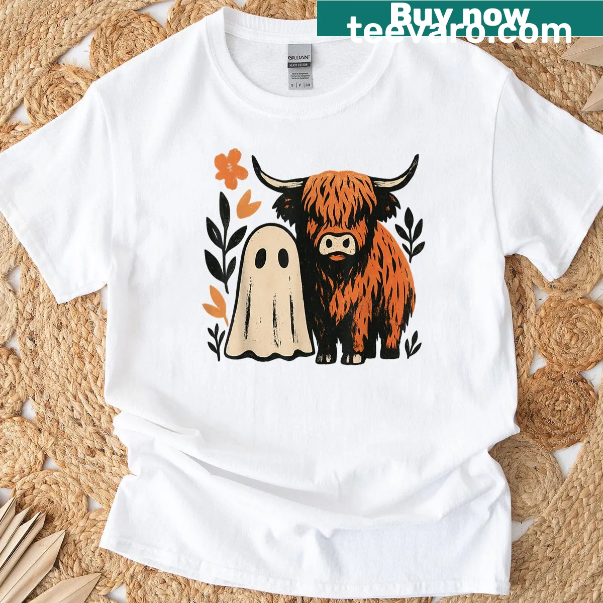 Cartoon Highland cow with ghost and pumpkin graphic — on a men's t-shirt