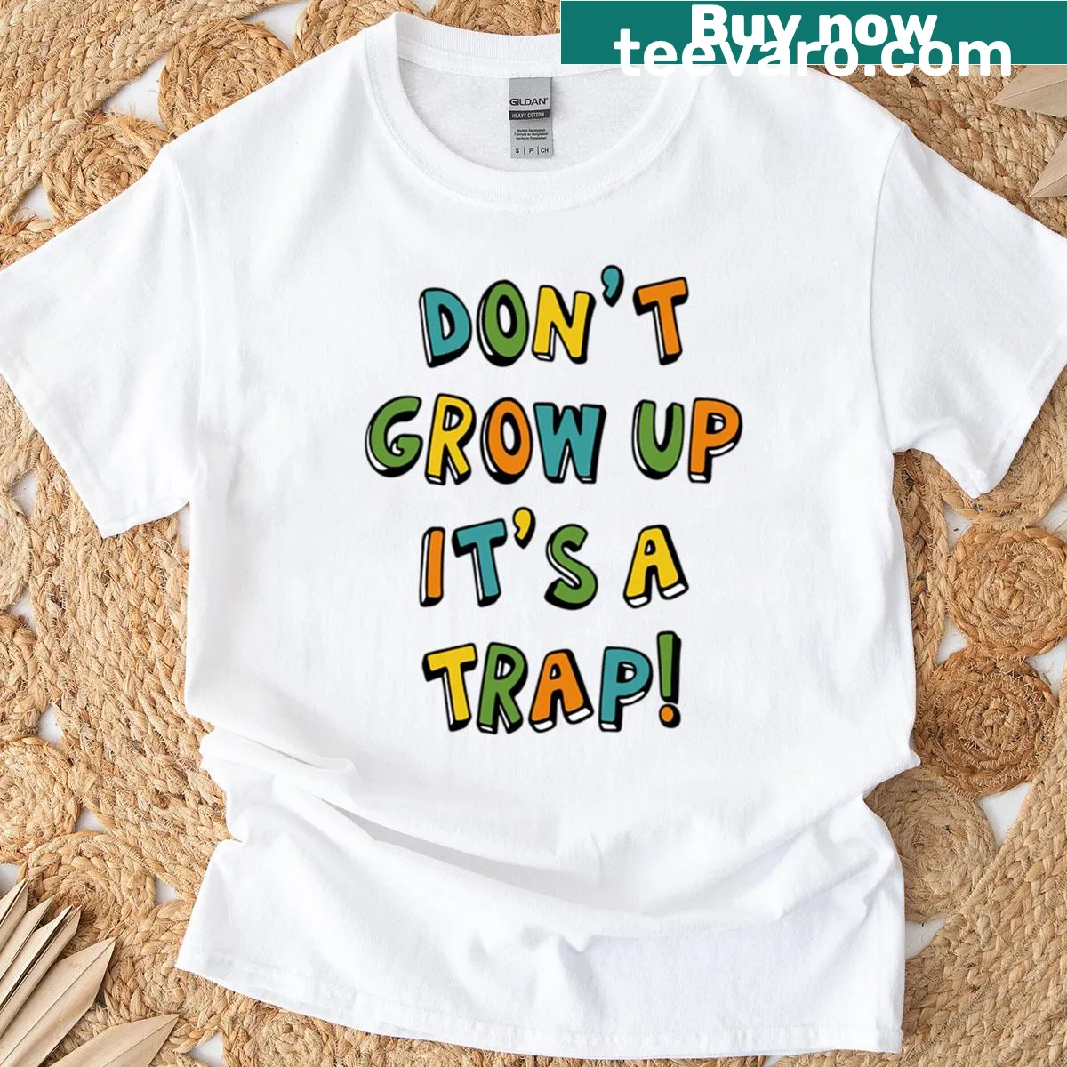 Playful humorous graphic saying 'Don't Grow Up, It's A Trap' on a t-shirt — on a men's t-shirt