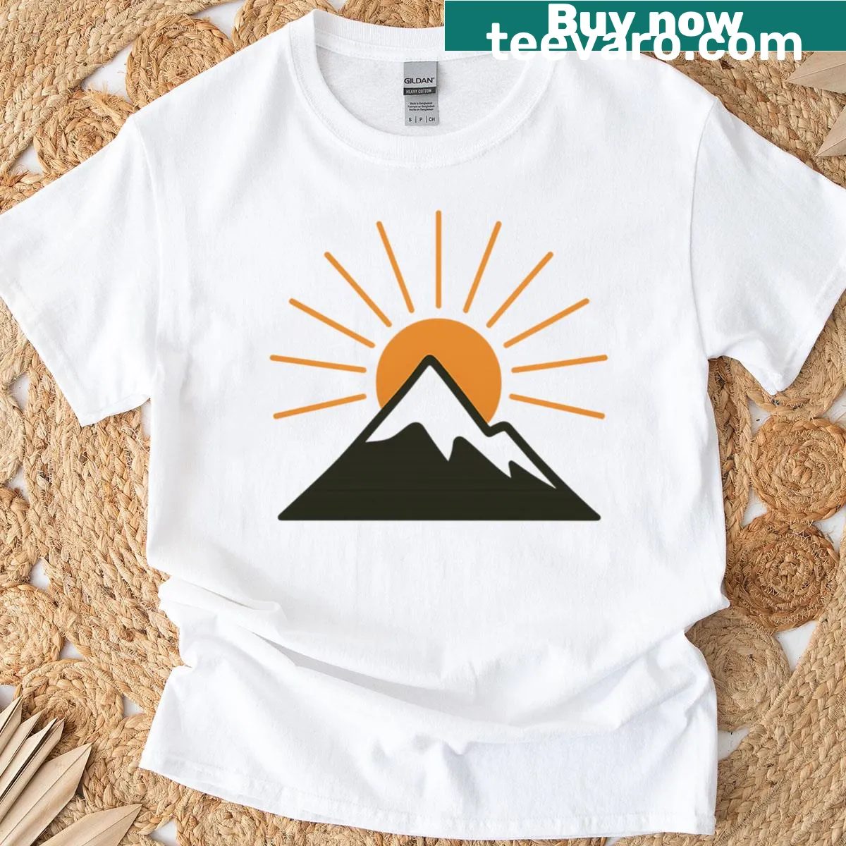 Minimalist T-shirt featuring mountain and sun line art — on a men's t-shirt