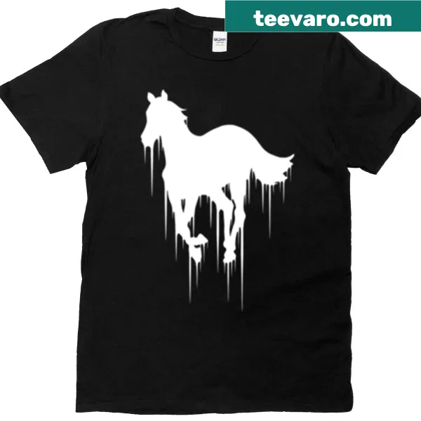 T-shirt featuring a whimsical illustration of a white pony