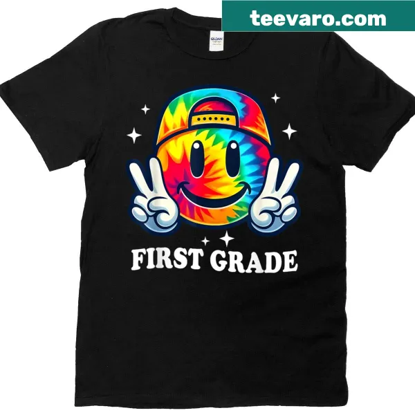 T-shirt with a smiley face illustration celebrating first grade excitement.