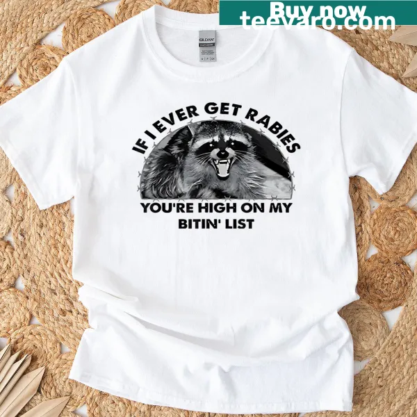 Humorous T-shirt featuring a cartoon raccoon and witty text about rabies.