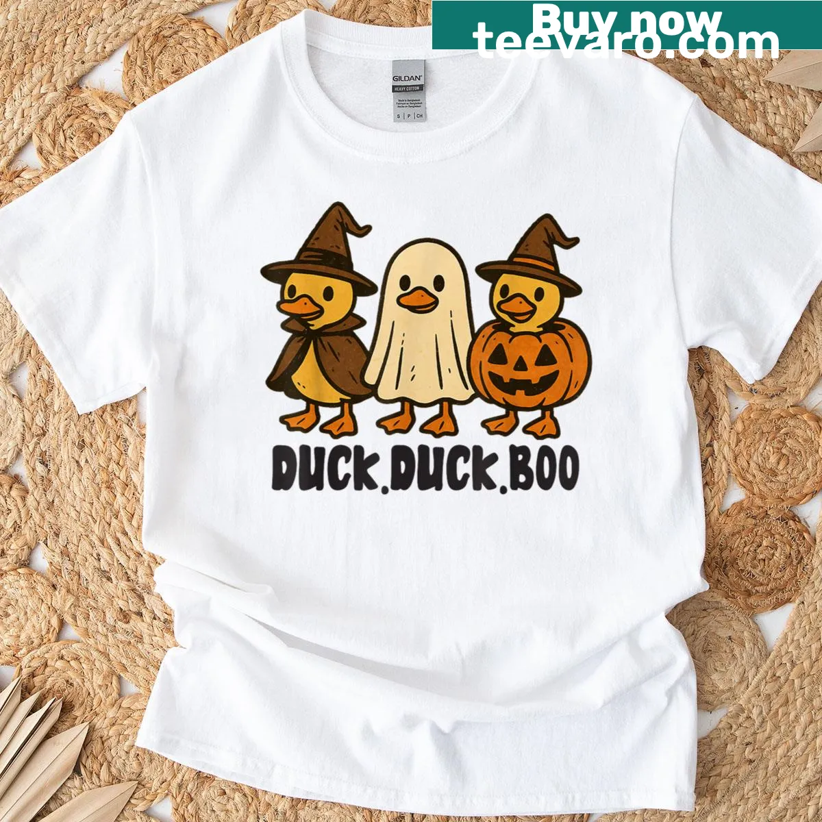 Cartoon Halloween design featuring a spooky duck, ghosts, and pumpkins. — on a men's t-shirt
