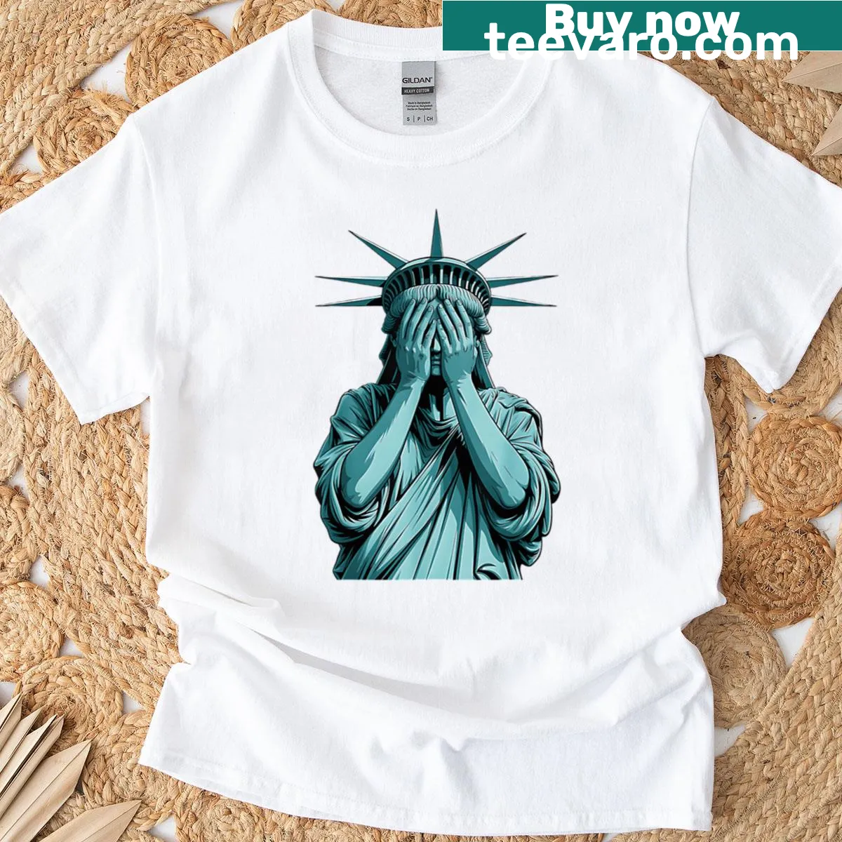 Oversized T-shirt featuring a graphic of a blood crying Statue of Liberty — on a men's t-shirt