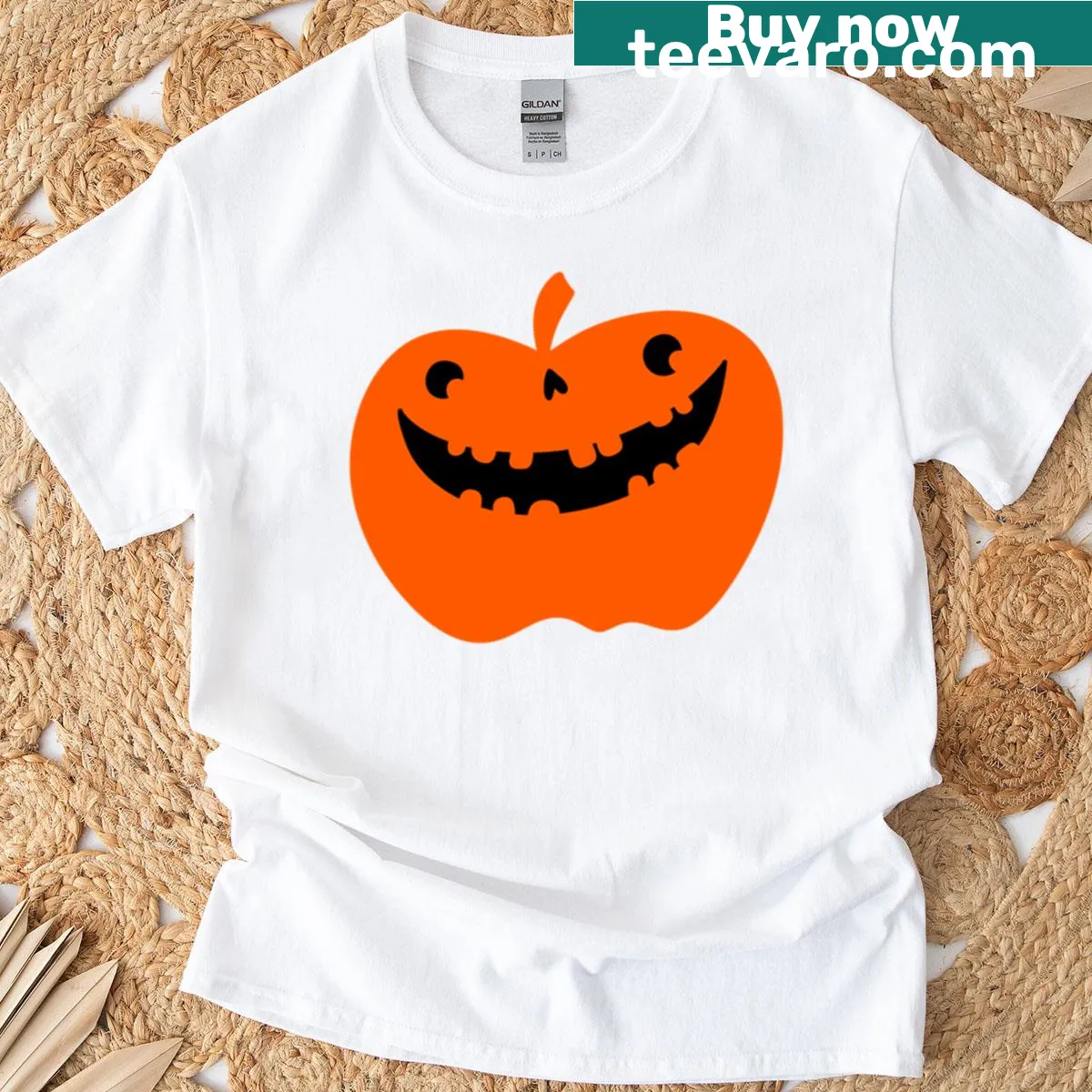 Cute oversized t-shirt with smiling pumpkin graphic for Halloween — on a men's t-shirt