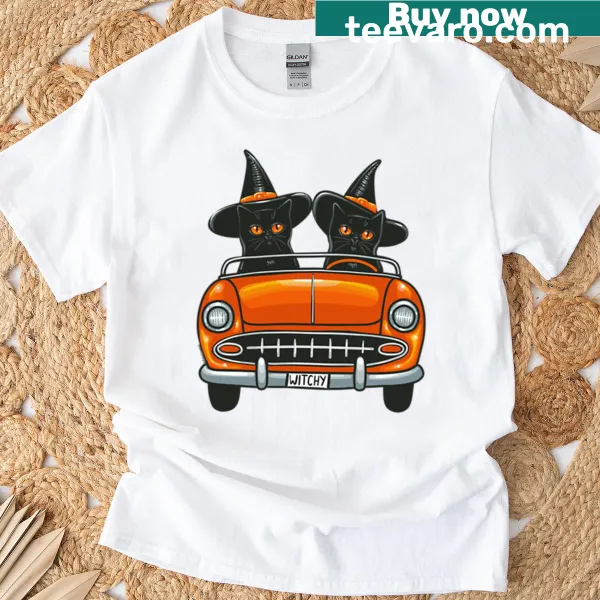 Oversized Halloween T-shirt featuring cute witchy cats illustration.