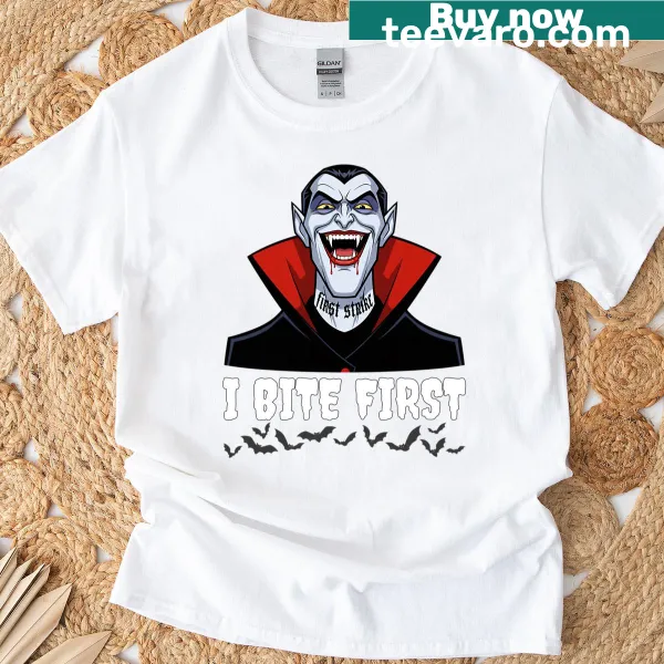 Halloween T-shirt with vampire-themed text 'I Bite First'