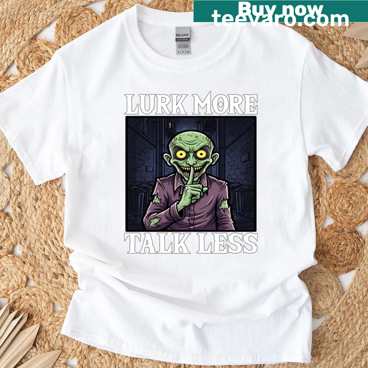 Halloween t-shirt featuring a playful monster graphic with the phrase 'Lurk More Talk Less' — on a men's t-shirt