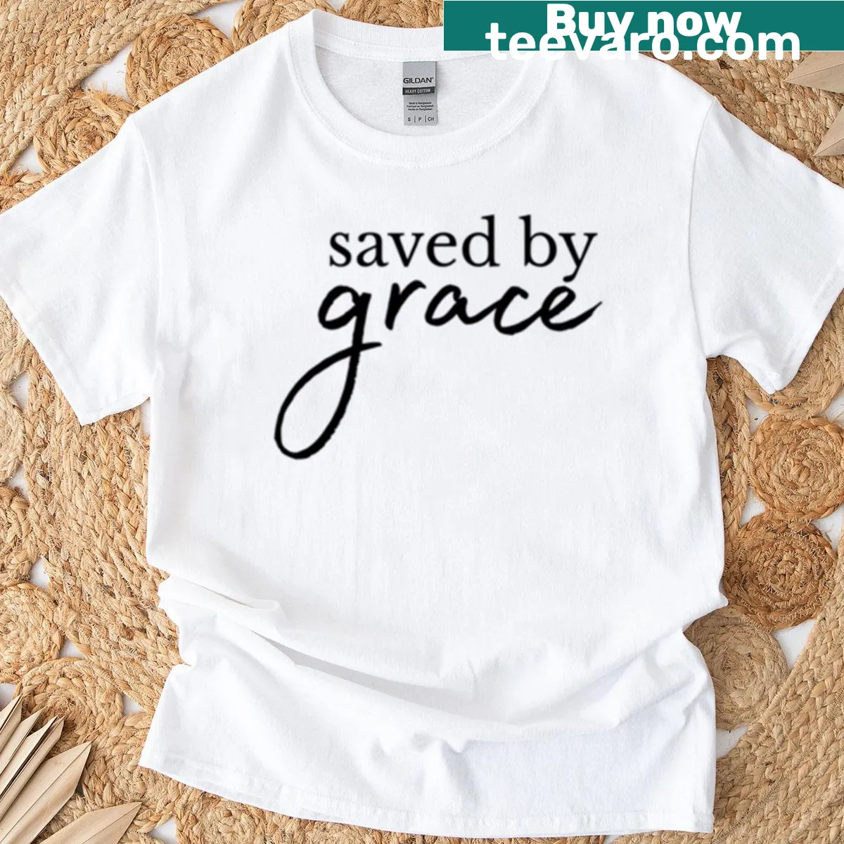 T-shirt with the phrase "Saved By Grace" promoting faith — on a men's t-shirt