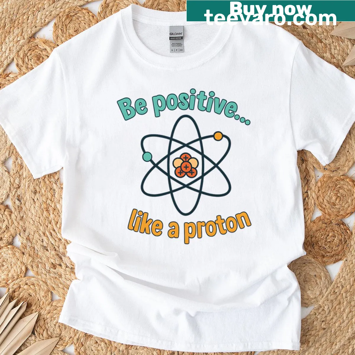 Proton graphic with Be Positive text for an uplifting message — on a men's t-shirt