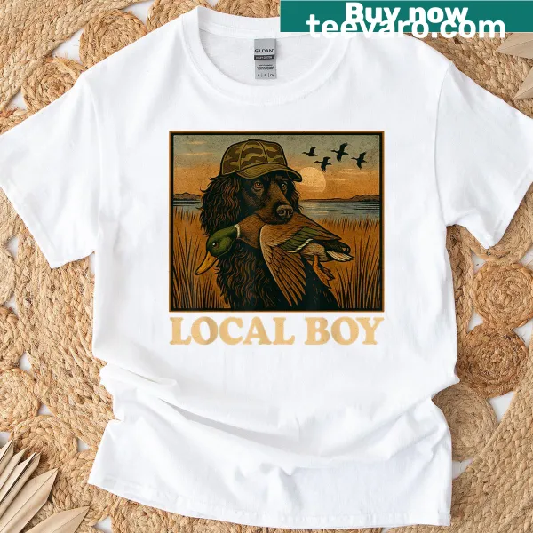 Vintage t-shirt featuring a black lab in a marsh scene at sunset.