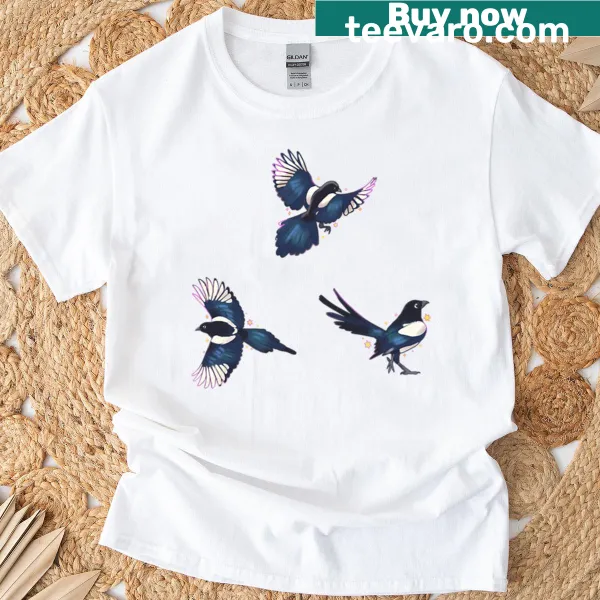 T-shirt featuring playful magpies in a whimsical design