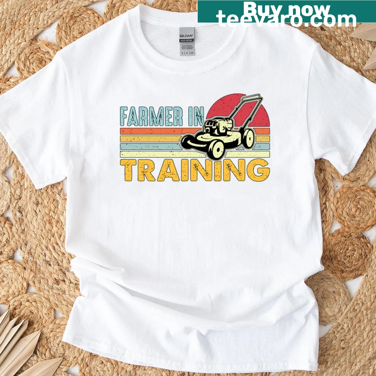 Retro style Farmer In Training t-shirt with a vintage mower graphic — on a men's t-shirt