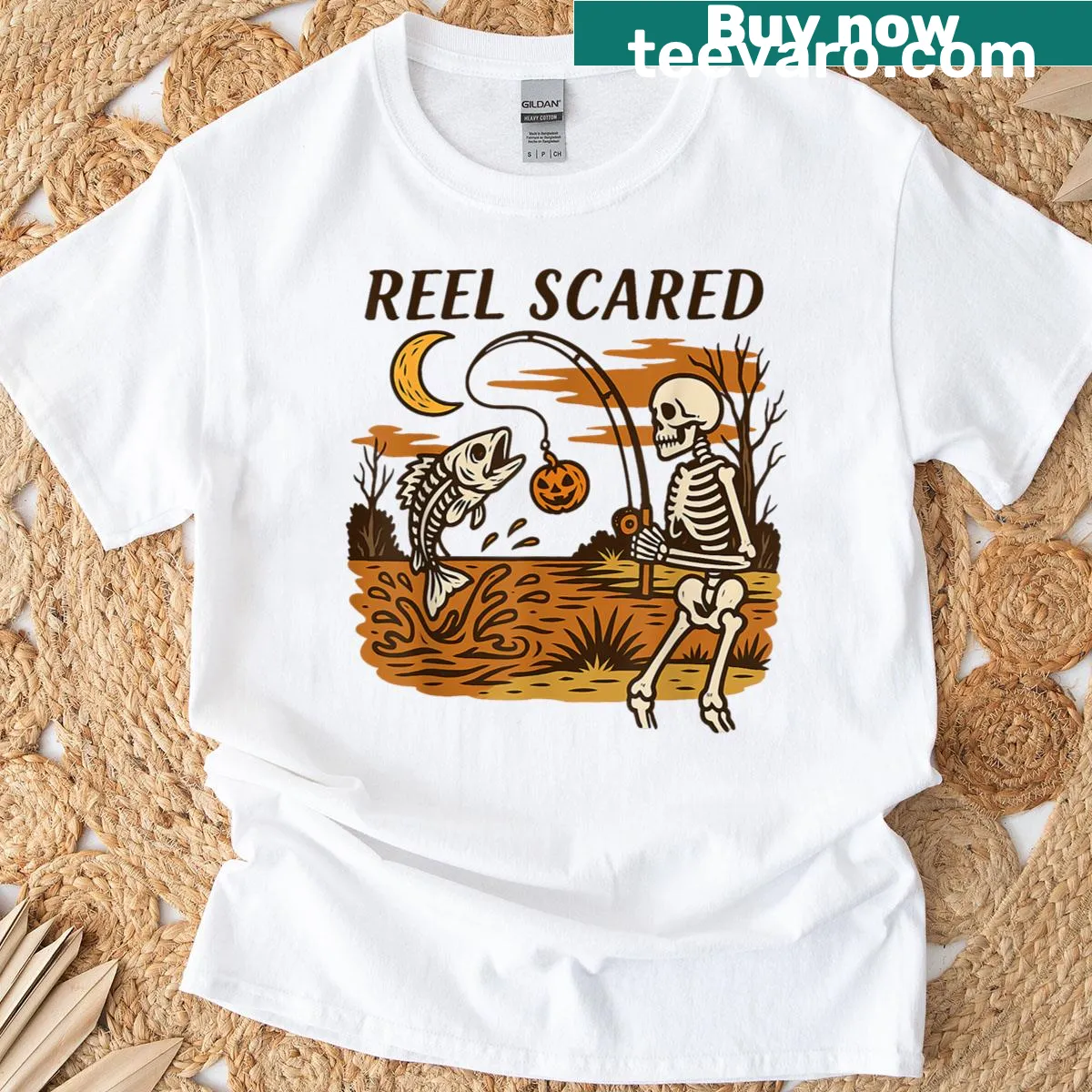 Humorous skeleton fisherman graphic with bass fish for Halloween — on a men's t-shirt
